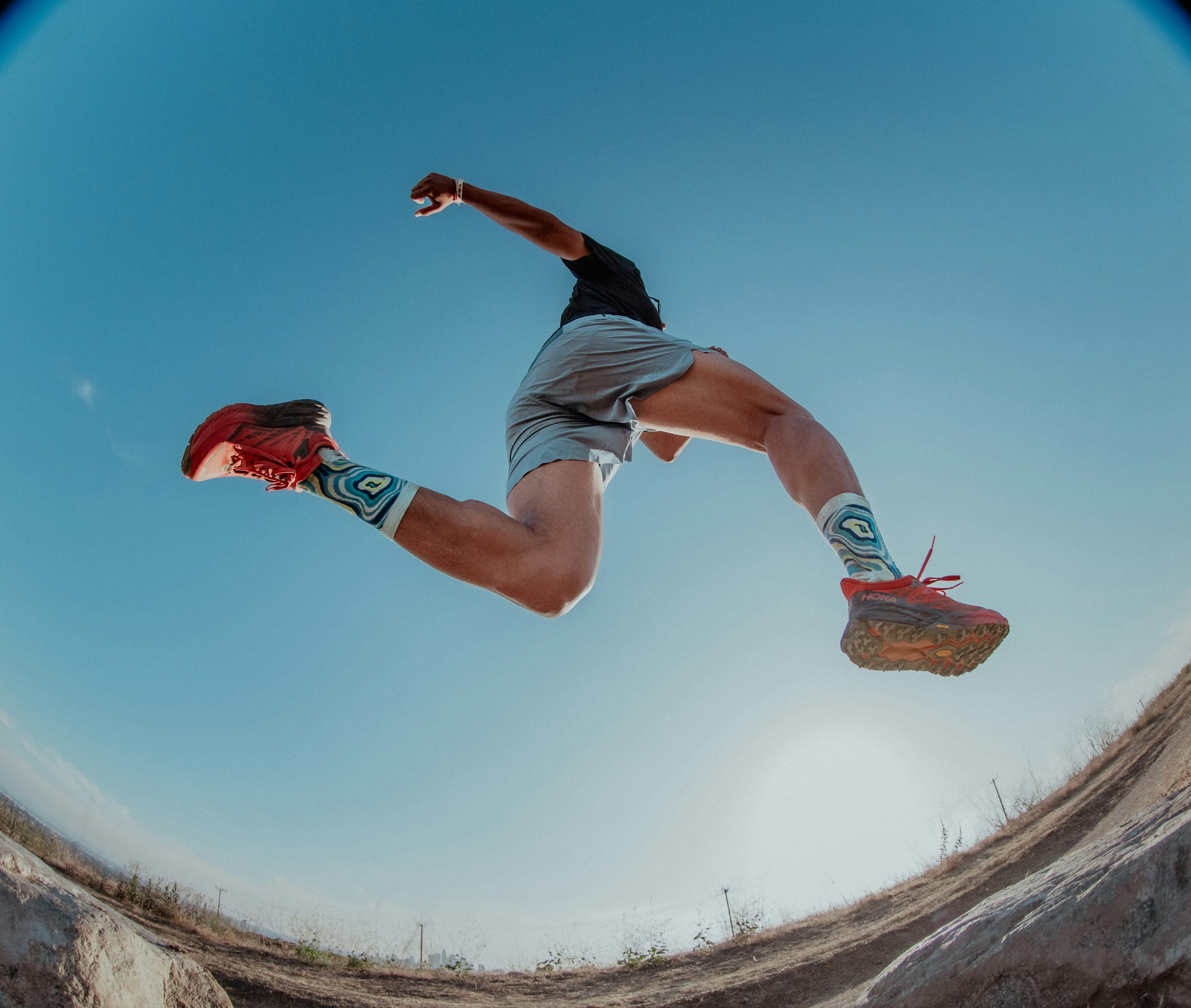 Runner jumping over the camera